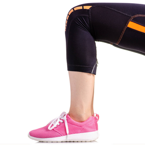 Female legs sports leggings sneakers sports exercises - Photo, image