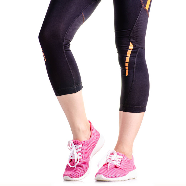 Female legs sports leggings sneakers sports exercises - Zdjęcie, obraz