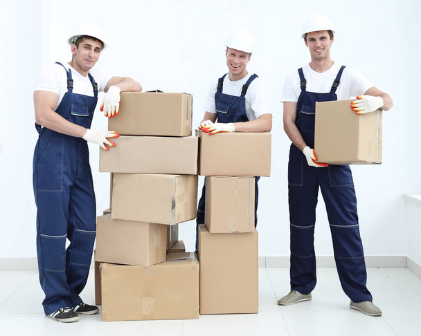 Group of people builders with boxes - Valokuva, kuva