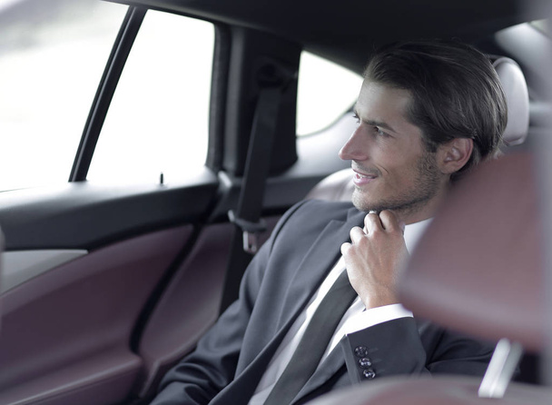 serious businessman sitting in car - Photo, Image