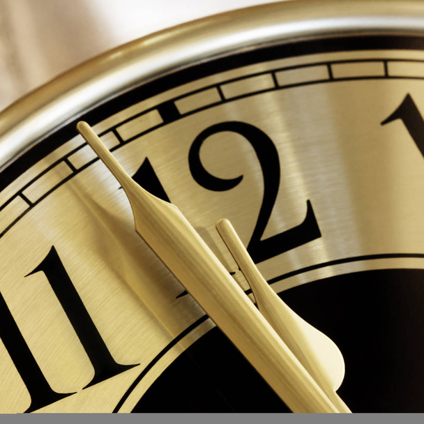 Golden clock face.  Closeup on two minutes to midnight. - Photo, Image