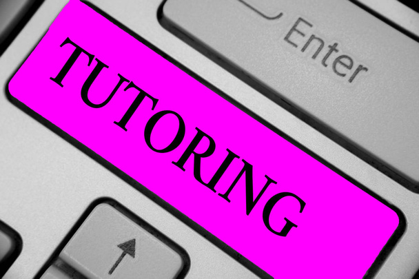 Handwriting text writing Tutoring. Concept meaning An act of a person employed to administer knowledge to someone Keyboard purple key Intention create computer computing reflection document - Photo, Image