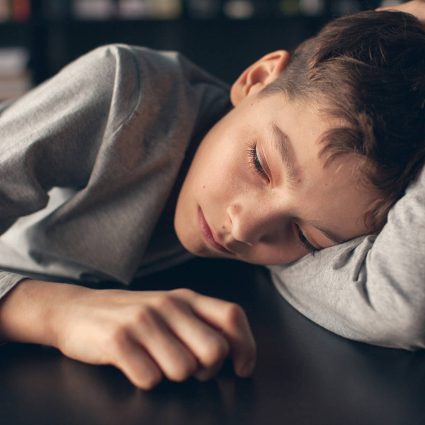 Sad boy. Depressed teenager at home. Problems at family - Valokuva, kuva