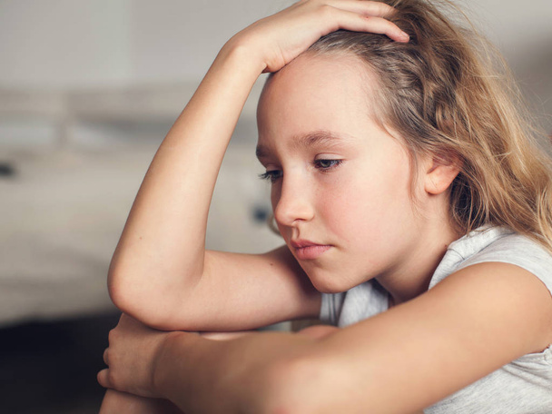Sad child at home. Abuse. Depression girl indoors - Photo, Image