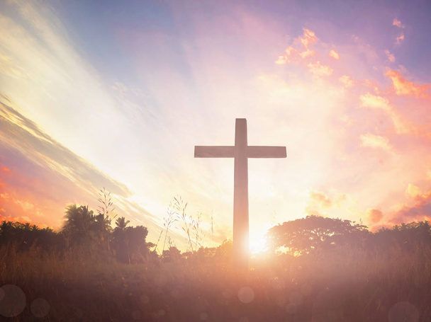 Silhueta cruz no prado nascer do sol fundo
 - Foto, Imagem
