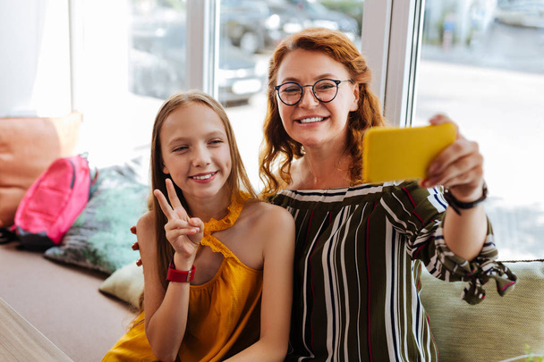 Modern loving mother making selfie with teenage daughter - Valokuva, kuva