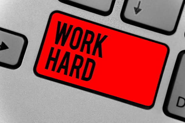 Text sign showing Work Hard. Conceptual photo Laboring that puts effort into doing and completing tasks Keyboard red key Intention create computer computing reflection document - Photo, Image