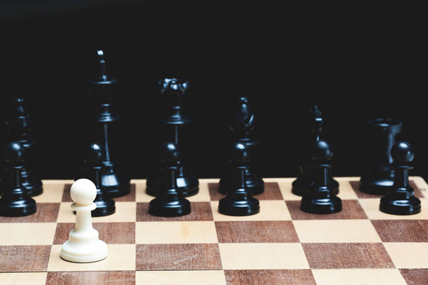 Chess pieces set on chessboard, close-up  - Fotó, kép