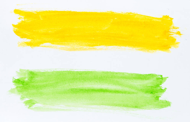 Set of watercolor brush strokes of green and yellow paint on whi - 写真・画像