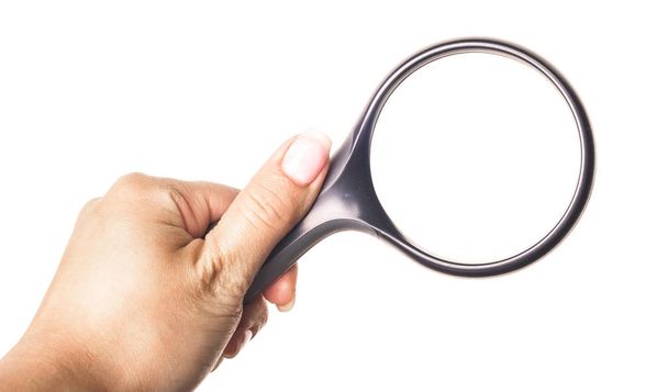 Hand holding magnifying glass isolated on white background - Photo, image