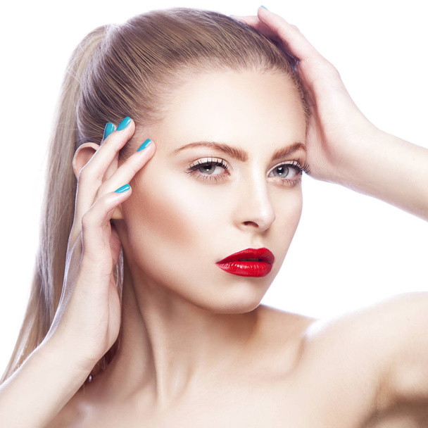 Portrait of woman with red lips and blue nail polish - Foto, afbeelding
