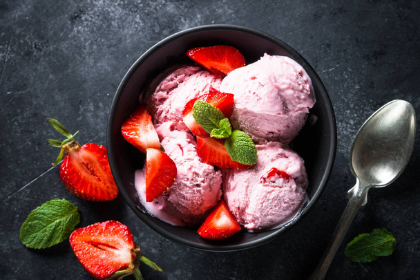 Strawberry ice cream on black. Top view.  - Photo, Image