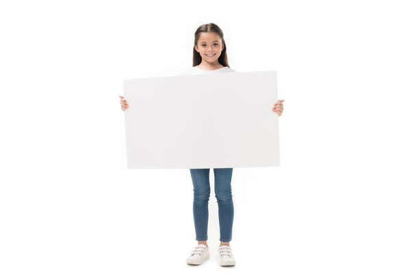 smiling child with blank banner in hands looking at camera isolated on white - Fotó, kép