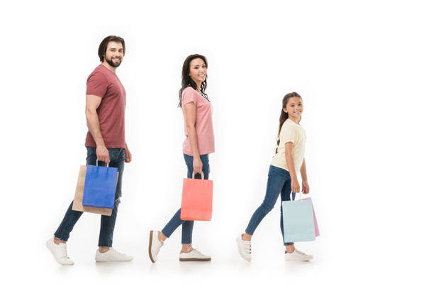 side view of family with shopping bags isolated on white - Φωτογραφία, εικόνα
