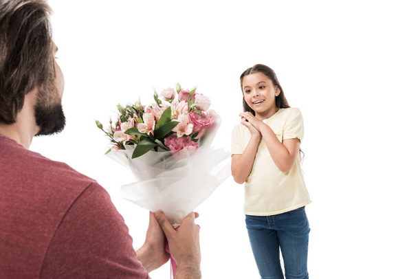 partial view of father presenting bouquet of flowers to little daughter isolated on white - Foto, Imagem