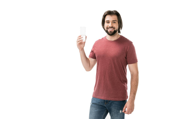 portrait of smiling bearded man with glass of water in hand isolated on white - Valokuva, kuva