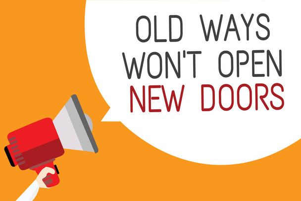 Text sign showing Old Ways Won t not Open New Doors. Conceptual photo be different and unique to Achieve goals Man holding megaphone loudspeaker speech bubble message orange background - Photo, Image