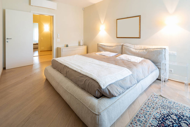 Elegant bedroom in modern villa. Nobody inside - 写真・画像