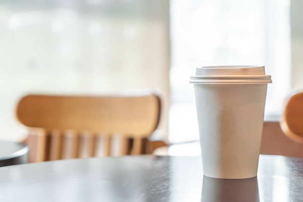 hot coffee paper cup in coffee shop and cafe - Photo, image