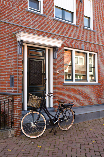 bike near traditional Dutch brick wal - 写真・画像