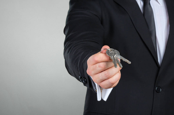 Unrecognizable businessman holding  keys - Zdjęcie, obraz