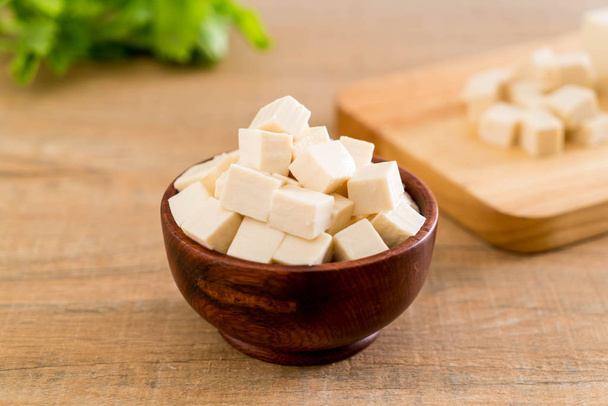 cube tofu on wooden board background - 写真・画像