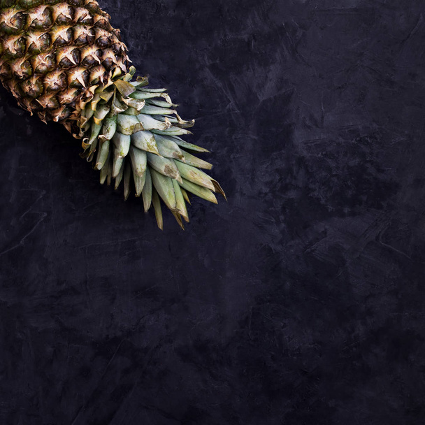 Fresh pineapple on a dark background - Фото, зображення