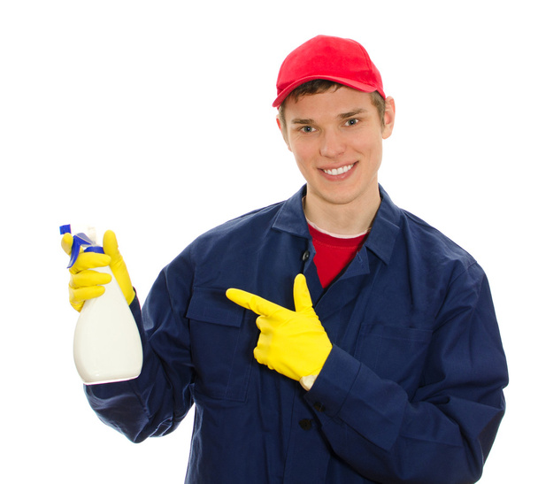 Young male window cleaner holding cleanser. Isolated on white - Фото, зображення