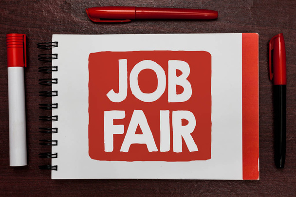 Text sign showing Job Fair. Conceptual photo An event where a person can apply for a job in multiple companies Important ideas highlighted notebook markers wooden table reminder message - Photo, Image