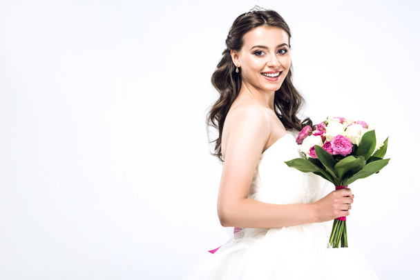 beautiful young bride in wedding dress with bouquet isolated on white - Fotografie, Obrázek