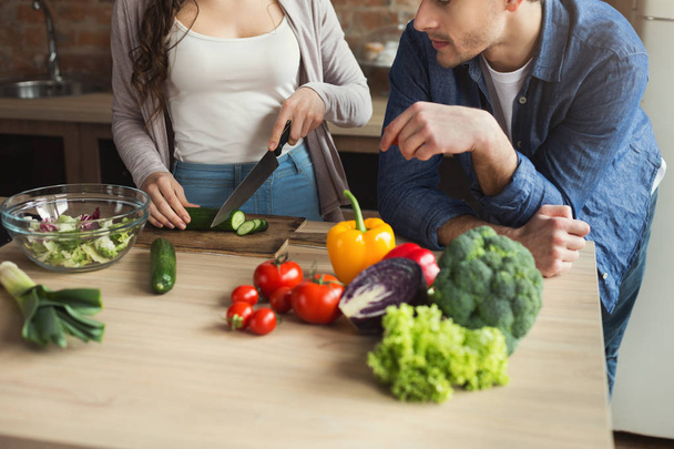 Closeup of couple cooking healthy food together - Foto, Imagem