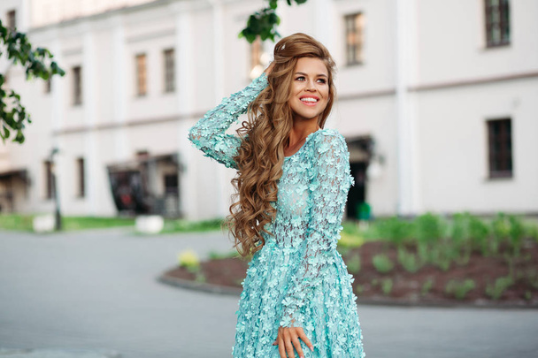 Gorgeous and beautiful girl wearing flowery blue cute dresses smiling.  - Photo, Image
