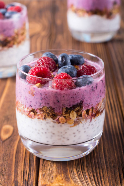 Chia yogurt with granola and berries  ( blueberries , raspberr - Фото, изображение