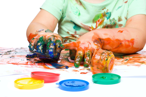 Little boy is playing with paints - Foto, Imagen