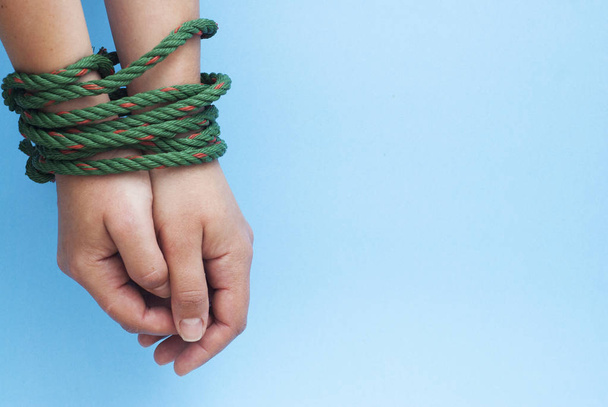 Tied Women Hands, Violence, Freedom Concept Isolated blue background - Valokuva, kuva
