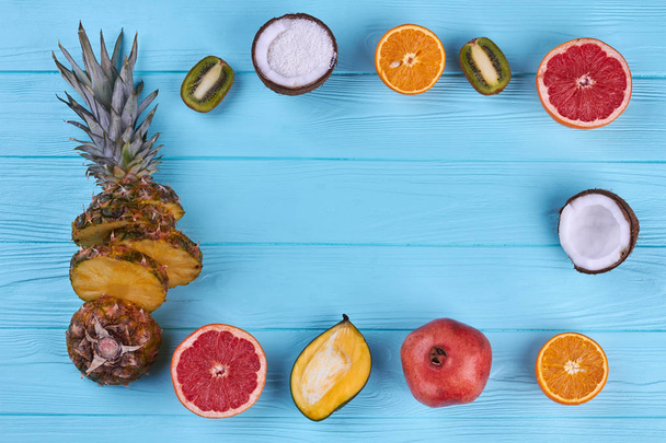 Frame from exotic fruits on color background. - Foto, Imagem