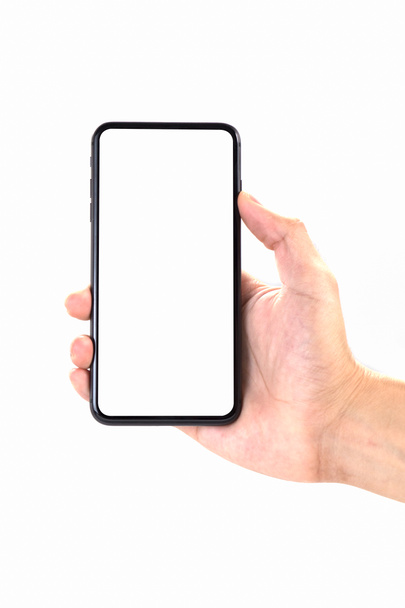 mão segurando smartphone isolado no fundo branco. - Foto, Imagem