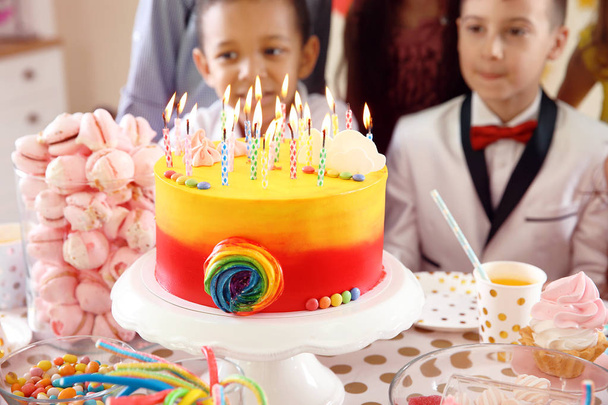 Cute children celebrating birthday at table indoors - Foto, imagen