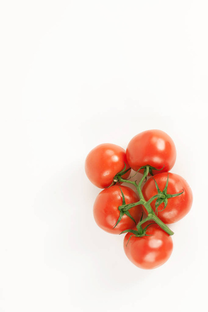 tomatoes on a branch .isolated white background - Photo, image