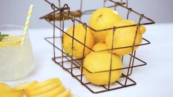 Step by step, making lemonade with fresh lemons and straw on the tray - Кадры, видео