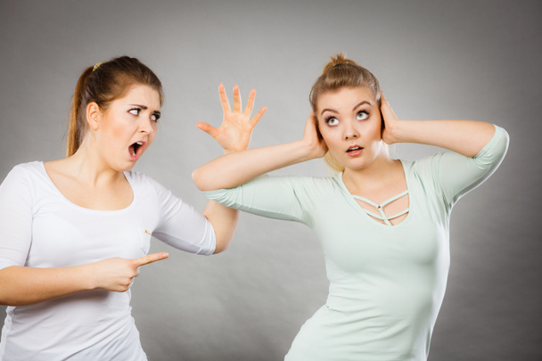 Two women having argue fight being mad at each other. Female telling off, ignorance concept. - Photo, Image