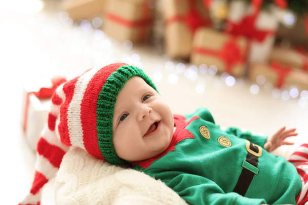 Cute baby in Christmas costume at home - Фото, зображення