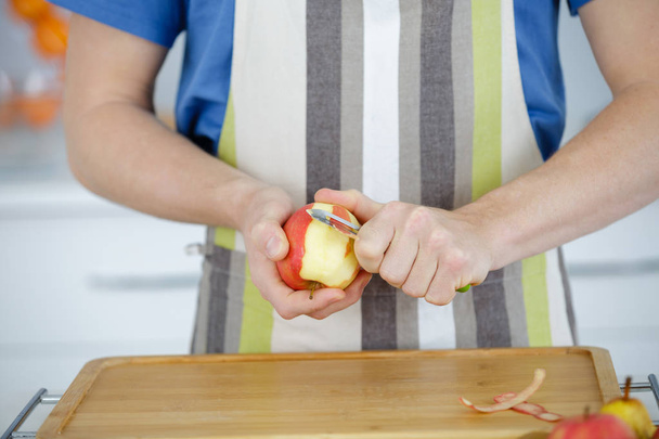 man peeling an apple cut out - Valokuva, kuva