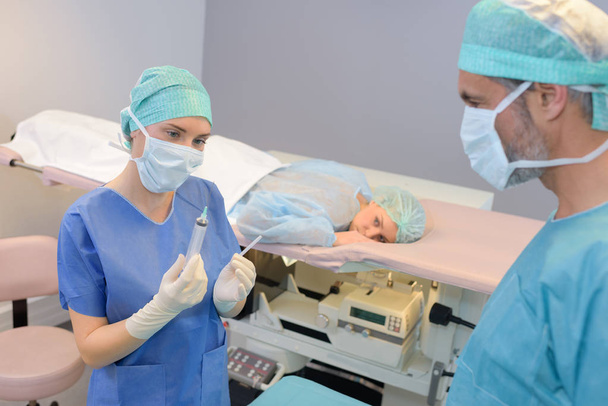 female surgeon anaesthetist at patient operating room - Photo, Image