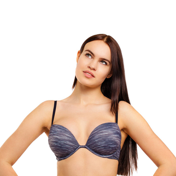 Young sexy brunette woman in blue bra, isolated on white background - Zdjęcie, obraz