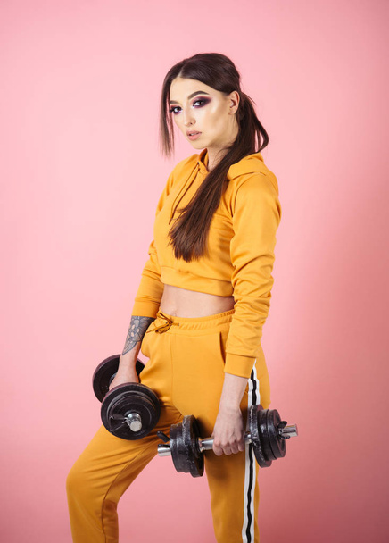 workout. workout in gym. woman workout with barbells. workout sportswear concept. - Fotografie, Obrázek