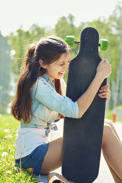 young woman with a longboard - 写真・画像