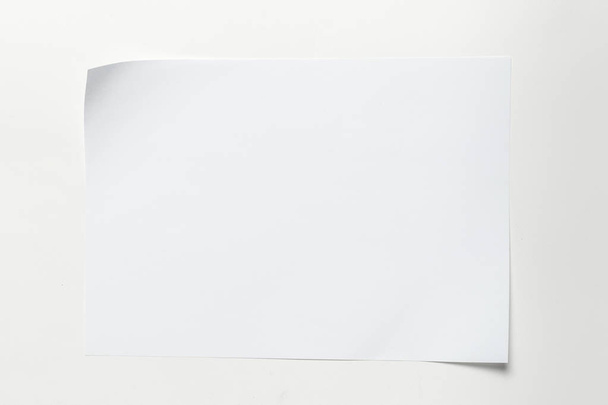White business card on wooden table. Blank portrait A4. - Foto, imagen