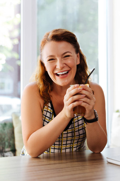Happy mature woman laughing while communicating with husband - Photo, Image
