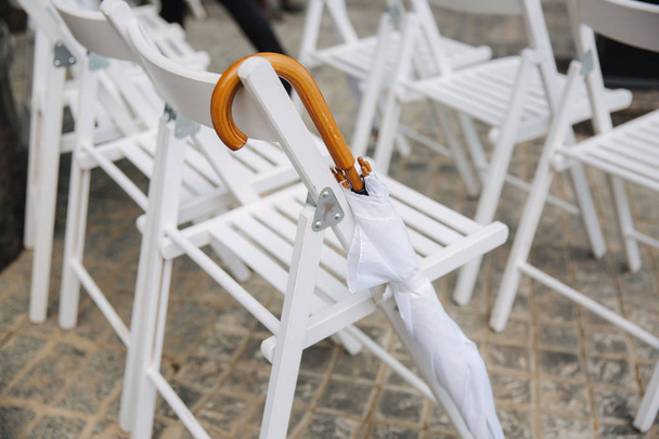 White chair with white umbrella. Wedding ceremony - Photo, Image
